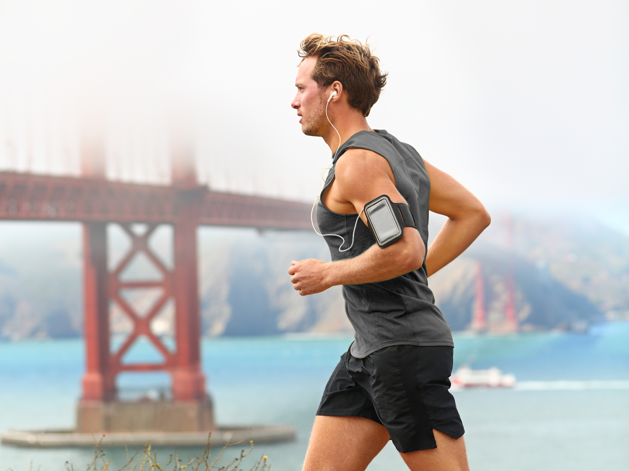 A man runs in front of San Francisco's Golden Gate bridge
